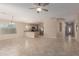 Open-concept living room and kitchen with stainless steel appliances and tiled floors at 4176 E Bonanza Rd, Gilbert, AZ 85297