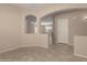 Open-concept living room features arched doorways and tile floors at 4176 E Bonanza Rd, Gilbert, AZ 85297