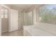 Primary bathroom with separate shower, soaking tub, and natural light at 4176 E Bonanza Rd, Gilbert, AZ 85297