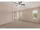 Spacious primary bedroom with ample natural light and access to ensuite bathroom at 4176 E Bonanza Rd, Gilbert, AZ 85297
