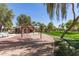 Park featuring swings, picnic pavilion, large grassy area, mature trees and green landscape at 4176 E Bonanza Rd, Gilbert, AZ 85297