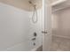 A shower and tub combination feature a modern shower head at 4176 E Bonanza Rd, Gilbert, AZ 85297