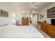 Inviting bedroom featuring a comfortable bed, soft lighting, and ample dresser storage at 4303 E Cactus S Rd # 329, Phoenix, AZ 85032