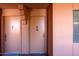 Apartment building exterior with entrance to condos, each with a small welcome mat at 4303 E Cactus S Rd # 329, Phoenix, AZ 85032