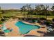 Aerial view of community pool area featuring lounge chairs and scenic mountain backdrop at 4303 E Cactus S Rd # 329, Phoenix, AZ 85032