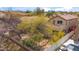 Aerial view of the property showcasing the backyard with a pool, mature trees, and the surrounding community at 4310 E Palo Brea Ln, Cave Creek, AZ 85331