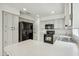Functional kitchen with ample counter space, light gray cabinets, and modern black appliances at 4310 E Palo Brea Ln, Cave Creek, AZ 85331