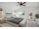 Spacious main bedroom featuring a ceiling fan, neutral decor, and access to an outdoor patio at 4310 E Palo Brea Ln, Cave Creek, AZ 85331