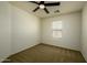 This bedroom features neutral walls, carpet and a ceiling fan at 4415 E High Point Dr, Cave Creek, AZ 85331
