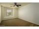 This bedroom features neutral walls, carpet and a ceiling fan at 4415 E High Point Dr, Cave Creek, AZ 85331