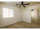 Neutral bedroom features natural light, carpet, ceiling fan and a mirrored closet at 4415 E High Point Dr, Cave Creek, AZ 85331