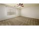 Neutral bedroom features natural light, carpet, ceiling fan and a spacious layout at 4415 E High Point Dr, Cave Creek, AZ 85331
