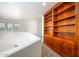 This spacious hallway area features a large built-in bookcase and natural lighting at 4415 E High Point Dr, Cave Creek, AZ 85331