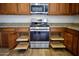 Close-up of kitchen appliances, wood cabinets and granite countertops in the kitchen at 4415 E High Point Dr, Cave Creek, AZ 85331