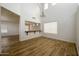 Bright living room features wood-look tile flooring, high ceilings, and clerestory windows at 4415 E High Point Dr, Cave Creek, AZ 85331