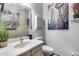 Powder room featuring art and decor, and a vessel sink at 44235 W Mcclelland Dr, Maricopa, AZ 85138