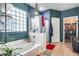 Bathroom featuring a tub, shower, tile floors, and a walk-in closet at 44235 W Mcclelland Dr, Maricopa, AZ 85138