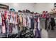 Walk-in closet featuring extensive shelving and storage for clothing and shoes at 44235 W Mcclelland Dr, Maricopa, AZ 85138