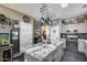 Elegant kitchen with a large granite island, stainless steel appliances, and ample cabinet space at 44235 W Mcclelland Dr, Maricopa, AZ 85138