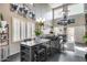 Bright, open living space with plantation shutters and artistic decor creates a welcoming atmosphere at 44235 W Mcclelland Dr, Maricopa, AZ 85138