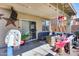 Covered patio featuring a lounge area, fire pit, a hanging swing and basketball hoop at 44235 W Mcclelland Dr, Maricopa, AZ 85138