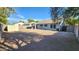 Fully fenced backyard with a covered patio, easy-care gravel, and plenty of room at 444 W Fabens Ln, Gilbert, AZ 85233