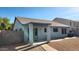 The home's backyard is fully fenced, with a covered patio, and easy-care gravel at 444 W Fabens Ln, Gilbert, AZ 85233