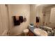 Clean bathroom with a blue countertop sink and shower, providing a functional and pleasant space at 444 W Fabens Ln, Gilbert, AZ 85233