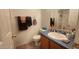 Bathroom featuring a single sink vanity, framed mirror, and tile floors at 444 W Fabens Ln, Gilbert, AZ 85233