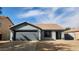 Charming single-story home with a two-car garage and desert landscaping on a sunny day at 444 W Fabens Ln, Gilbert, AZ 85233