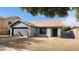 Single story home featuring low-maintenance desert landscaping, a garage, and a welcoming entry at 444 W Fabens Ln, Gilbert, AZ 85233