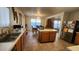 Open kitchen offers lots of natural light, stainless steel appliances, and a center island, perfect for food preparation at 444 W Fabens Ln, Gilbert, AZ 85233