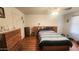 Bedroom features light-colored walls and wood laminate flooring at 444 W Fabens Ln, Gilbert, AZ 85233