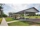 Covered park pavilion with picnic tables and a playground in a community green space at 444 W Fabens Ln, Gilbert, AZ 85233