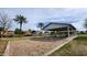 Park swings, tables, and shade structure surrounded by green space at 444 W Fabens Ln, Gilbert, AZ 85233