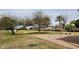 Community park view with swing set and mature trees at 444 W Fabens Ln, Gilbert, AZ 85233
