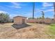 Backyard with a cinder block shed and block wall with a clear blue sky above at 4617 N 8Th Pl, Phoenix, AZ 85014