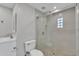 Bathroom featuring shower with glass enclosure and grey tile, plus a toilet and sink at 4617 N 8Th Pl, Phoenix, AZ 85014