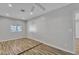 Bright, airy bedroom with a ceiling fan and neutral walls and a wood look floor at 4617 N 8Th Pl, Phoenix, AZ 85014