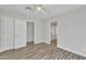 Bright bedroom with wood-look flooring and a ceiling fan, illuminated by natural light at 4617 N 8Th Pl, Phoenix, AZ 85014