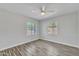 Bedroom with neutral-toned walls, two windows, and wood-look flooring at 4617 N 8Th Pl, Phoenix, AZ 85014