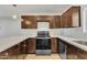 Contemporary kitchen with a stone countertop, recessed lighting, and sleek stainless steel appliances at 4617 N 8Th Pl, Phoenix, AZ 85014