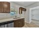 Updated kitchen with stainless steel dishwasher and a view from the window over the sink at 4617 N 8Th Pl, Phoenix, AZ 85014