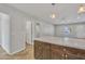 Open-concept kitchen featuring an island with countertop and dark wood cabinetry at 4617 N 8Th Pl, Phoenix, AZ 85014