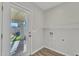 Utility room with open shelving, laundry hookups, and access to the outdoors at 4617 N 8Th Pl, Phoenix, AZ 85014
