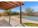 Corner backyard featuring a pool, covered patio, landscaping and plenty of room for outdoor activities at 5741 W Purdue Cir, Glendale, AZ 85302