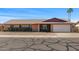 Charming one-story home with a brick facade, well-maintained landscaping, and an attached garage at 5741 W Purdue Cir, Glendale, AZ 85302