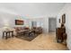 Inviting living room with hardwood floors, shuttered windows, and a cozy seating arrangement at 5741 W Purdue Cir, Glendale, AZ 85302
