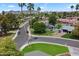 Picturesque aerial view of neighborhood featuring palm trees, well-maintained lawns and tree lined streets at 601 E Winter Dr, Phoenix, AZ 85020