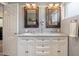Bathroom features a double vanity with framed mirrors, white cabinets, and plenty of counter space at 601 E Winter Dr, Phoenix, AZ 85020